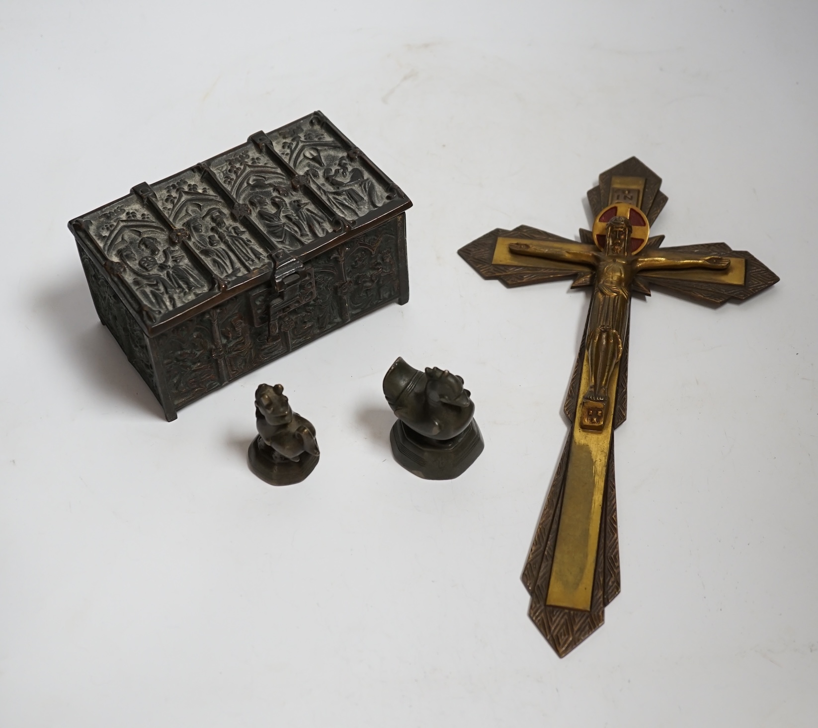 A bronze gothic casket, two Burmese bronze weights and a cast brass crucifix, 31.5cm